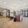 Lobby at McDowell Point apartments in Naperville, IL, featuring wood grain floor paneling and cushioned seating.