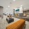 Resident lounge at McDowell Point apartments in Naperville, IL, featuring carpeted flooring and long couches.