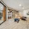 Resident lounge and library at McDowell Point apartments in Naperville, IL, featuring cushioned chairs and a fireplace.