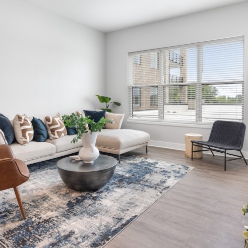 a living room with a couch and chairs
