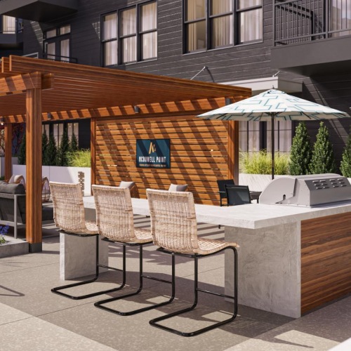 Enjoy our resident-only features Outdoor lounge at McDowell Point apartments in Naperville, IL, featuring grill stations and outdoor furniture.